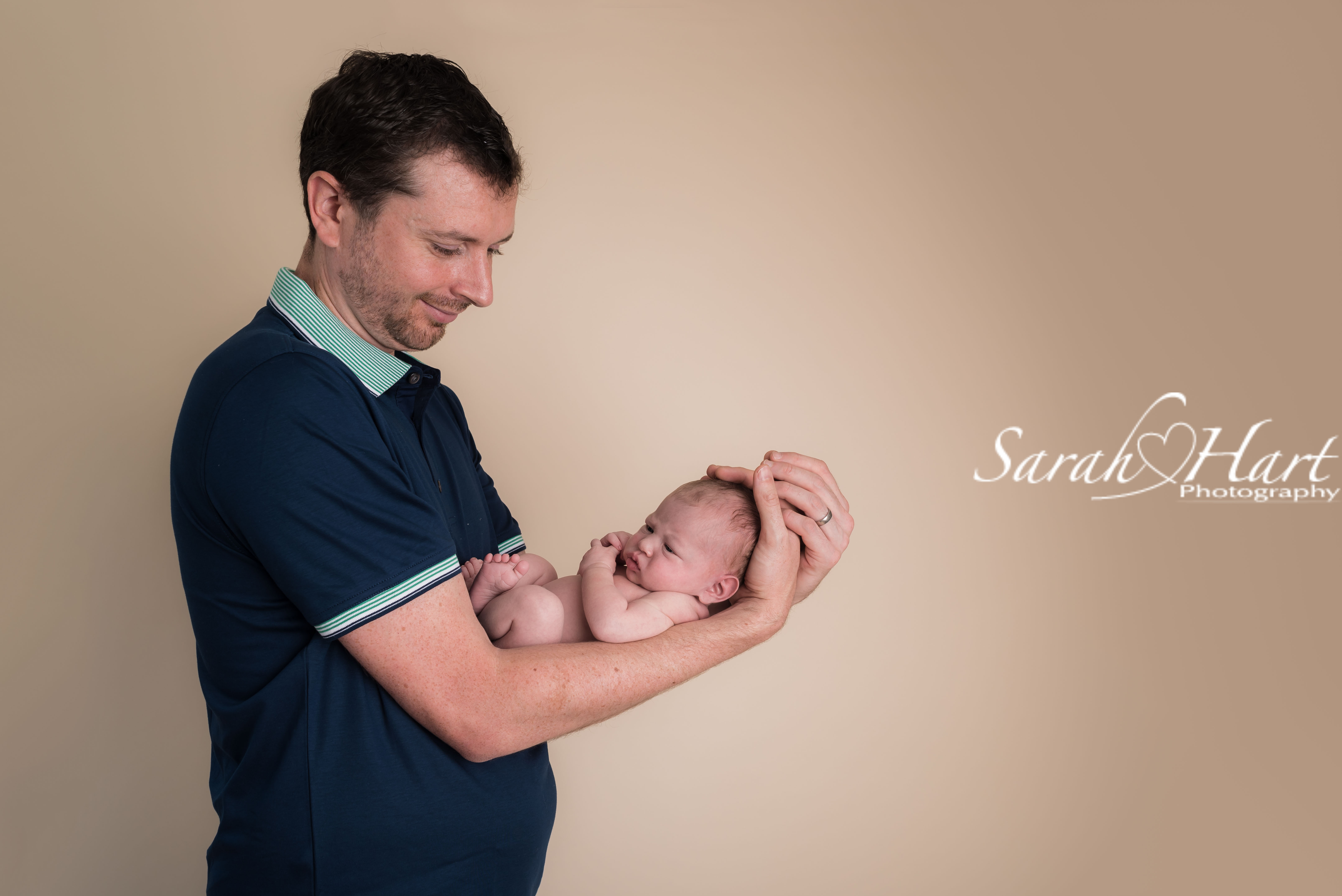 In daddy's arms, newborn photography with Sarah Hart, Tonbridge, Kent & East Sussex