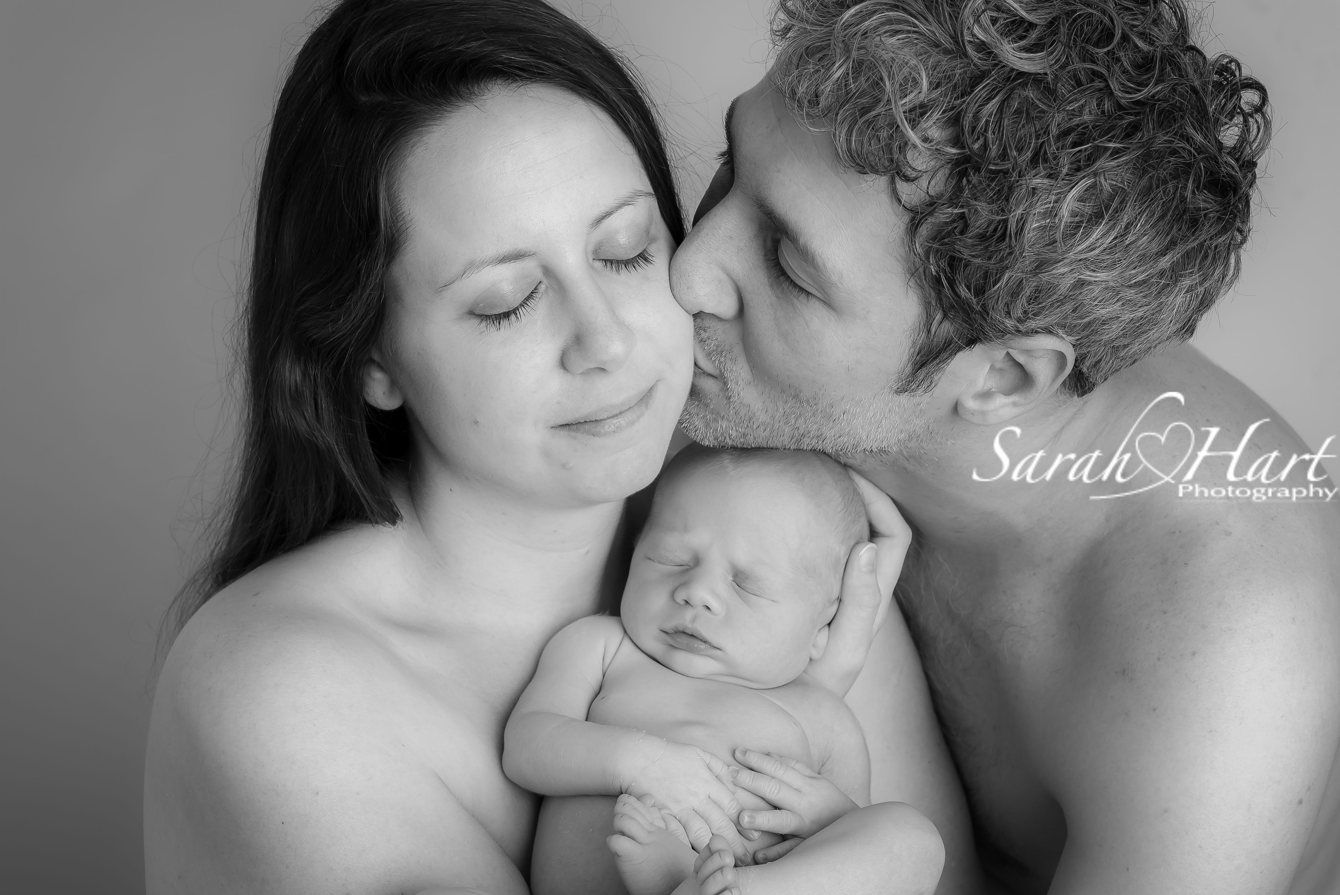 Parents holding newborn baby, Tonbridge & Tunbridge Wells photographer, Kent