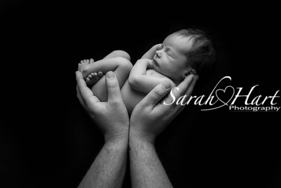 newborn baby held in Daddy's hands, Kent baby photographer