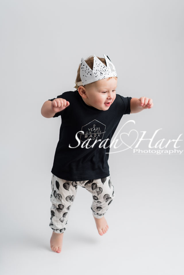 boy jumping up and down toddler in birthday photoshoot, kent photographer