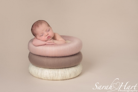 Baby in posing rings, neutral colours, simplicity, beautiful baby photography, Tonbridge Kent