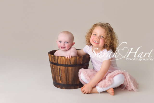 Siblings, baby and child photographer in Kent, baby in a bucket, baby soft skin, Tonbridge