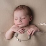 sleeping baby with mum's charm bracelet, precious baby memories captured, Kent baby photographer