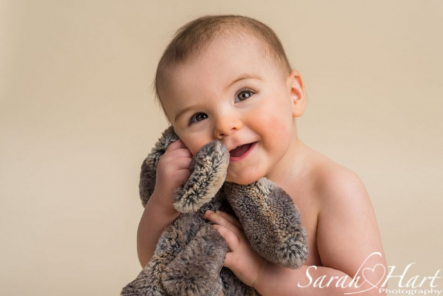 baby hugging bunny soft toy, beautiful smile, kent photographer