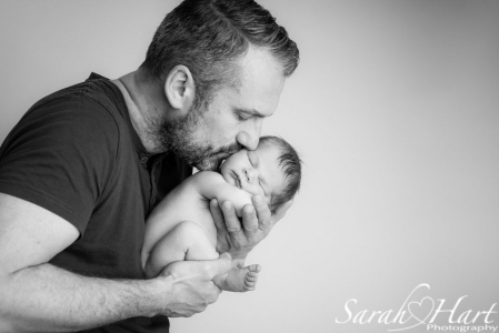 Precious bundle in Dad's hands, kisses for your baby, baby photography tonbridge