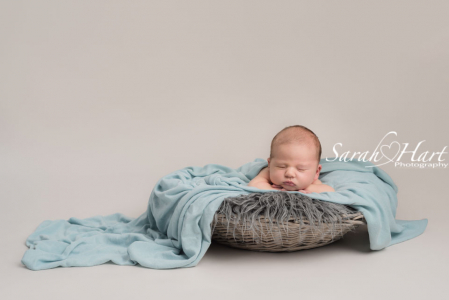 newborn in basket, pastel tones, best newborn photographer kent