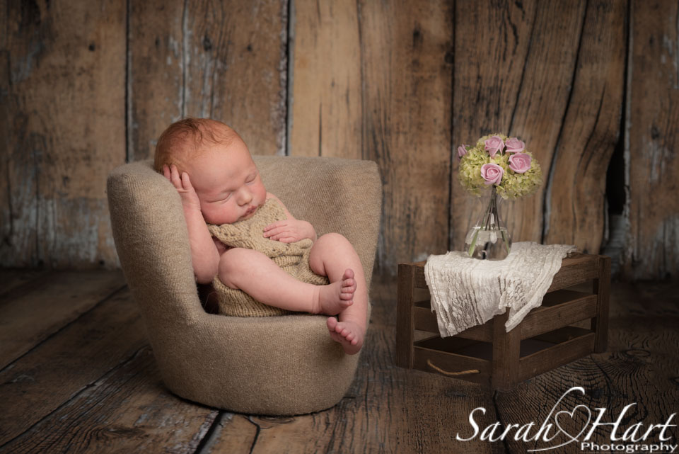 newborn dozing in armchair, baby art, photos by Sarah Hart Photography