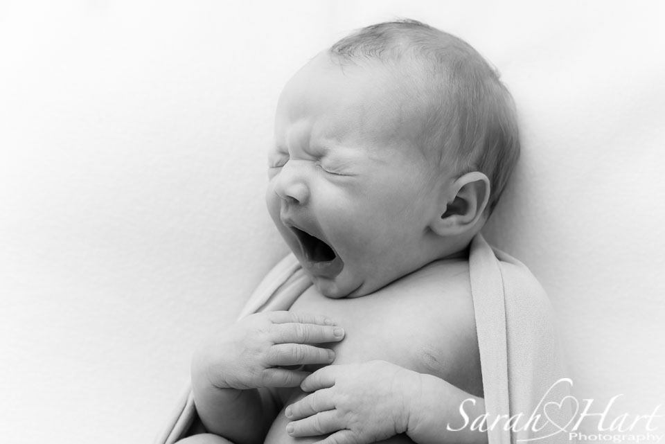 yawny newborn face, baby photos sevenoaks