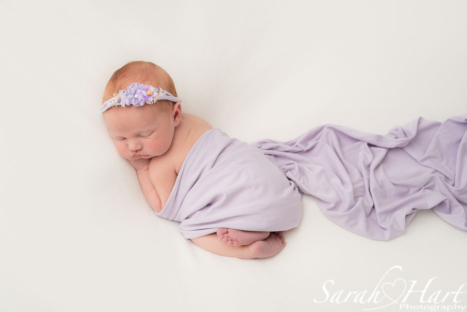 newborn photographer in tonbridge kent, lilac wrap and pretty lilac headband