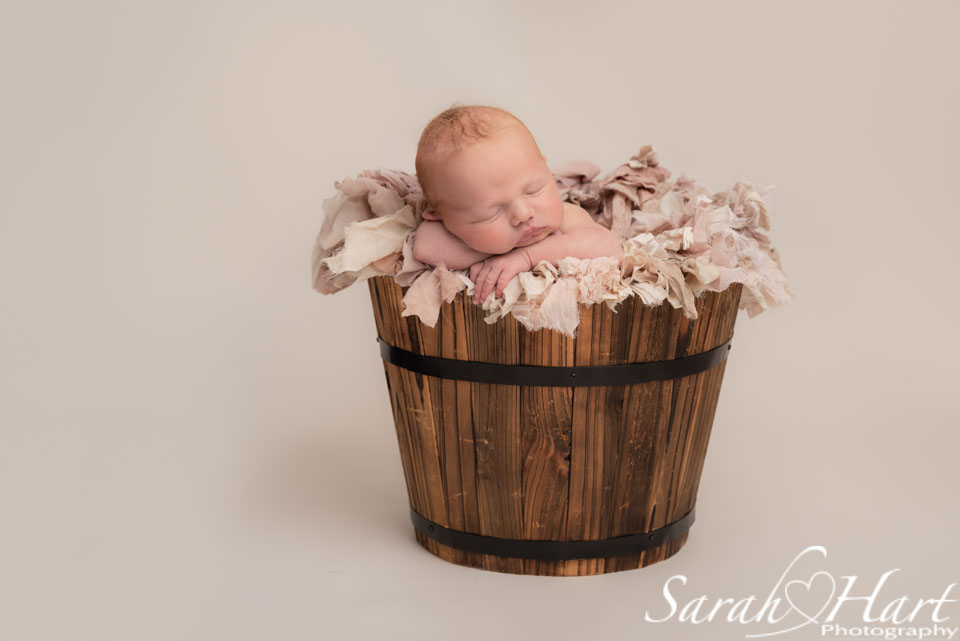 baby in pink ruffles, newborn photographer tunbridge wells