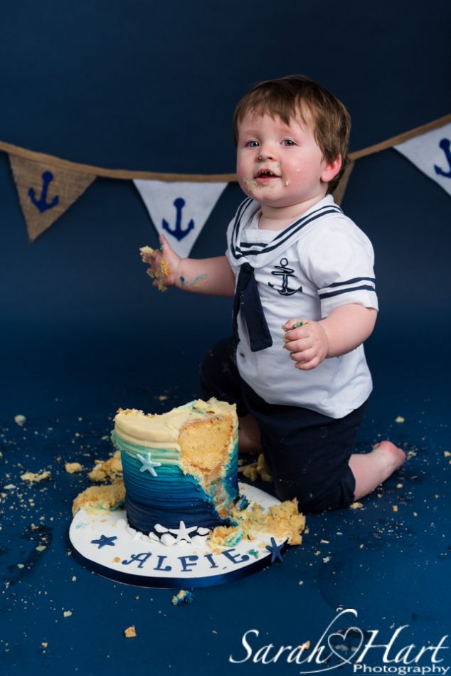 sailor theme, boy smashes cake at his cake smash