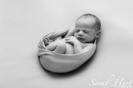 black and white newborn curled up, Sarah Hart Photography, Kent