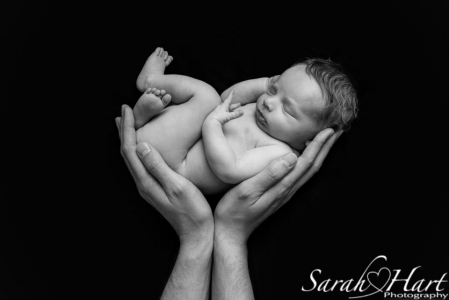 newborn in daddy's hands, newborn photography art