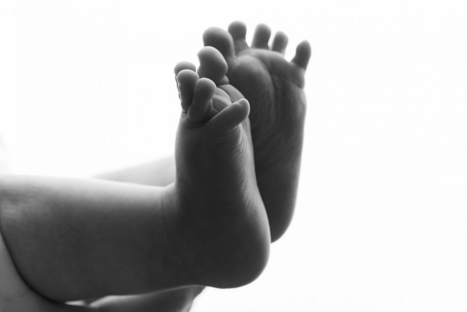 backlit detail shot of baby feet, photographing your own baby