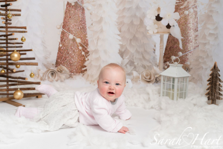 baby girl in fake snow, Xmas mini session, edenbridge family photographer