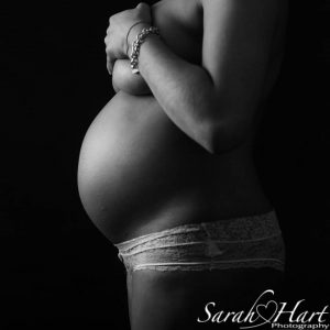pregnant woman's bump in black and white maternity photography
