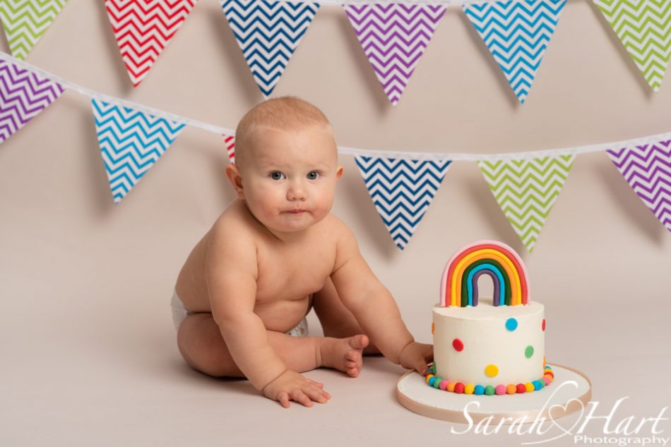 Baby boy at his rainbow baby cake smash, Sevenoaks Cake Smash Photographer