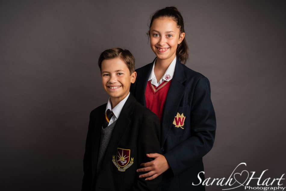 Tonbridge photographer captures two siblings at different schools in school photography package.